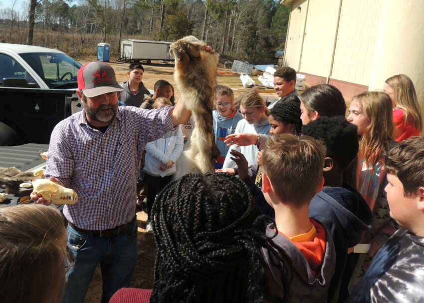 Area Wildlife Biologist, Russell Singleton teaches students about local wildlife.